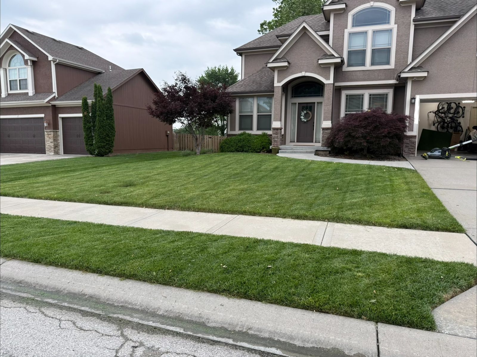 Freshly mowed front lawn by C&B Mowing & More